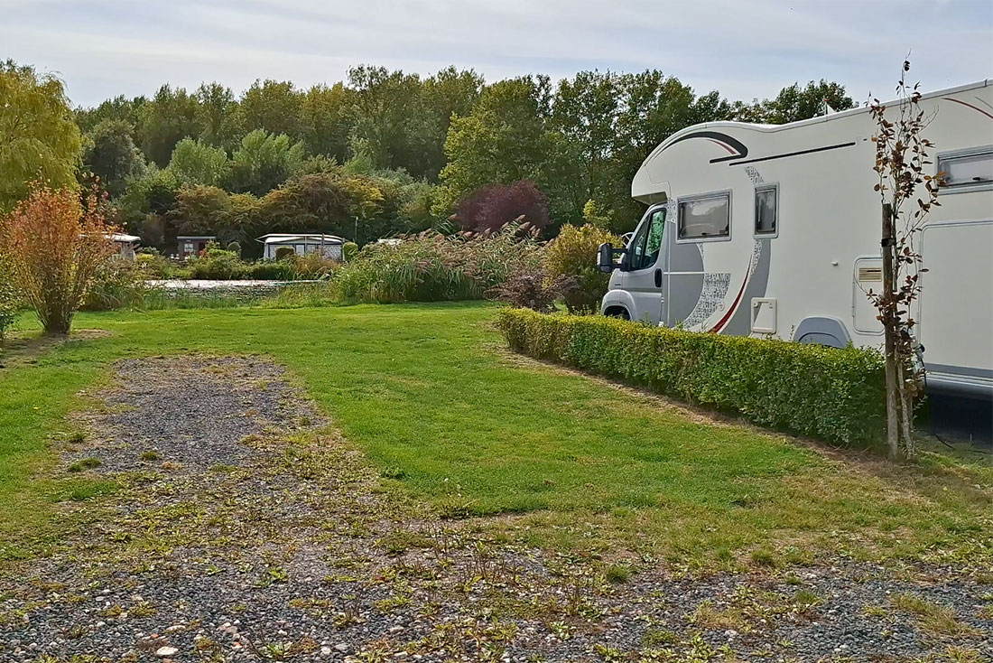 Paved camper pitches with electricity supply at De Brongaard